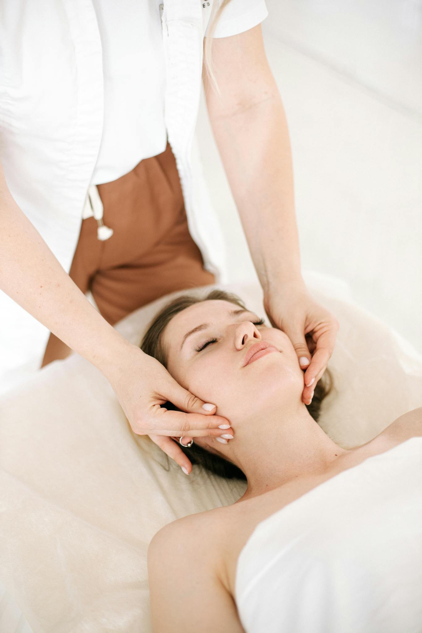 A soothing facial massage therapy session promoting relaxation and wellness.