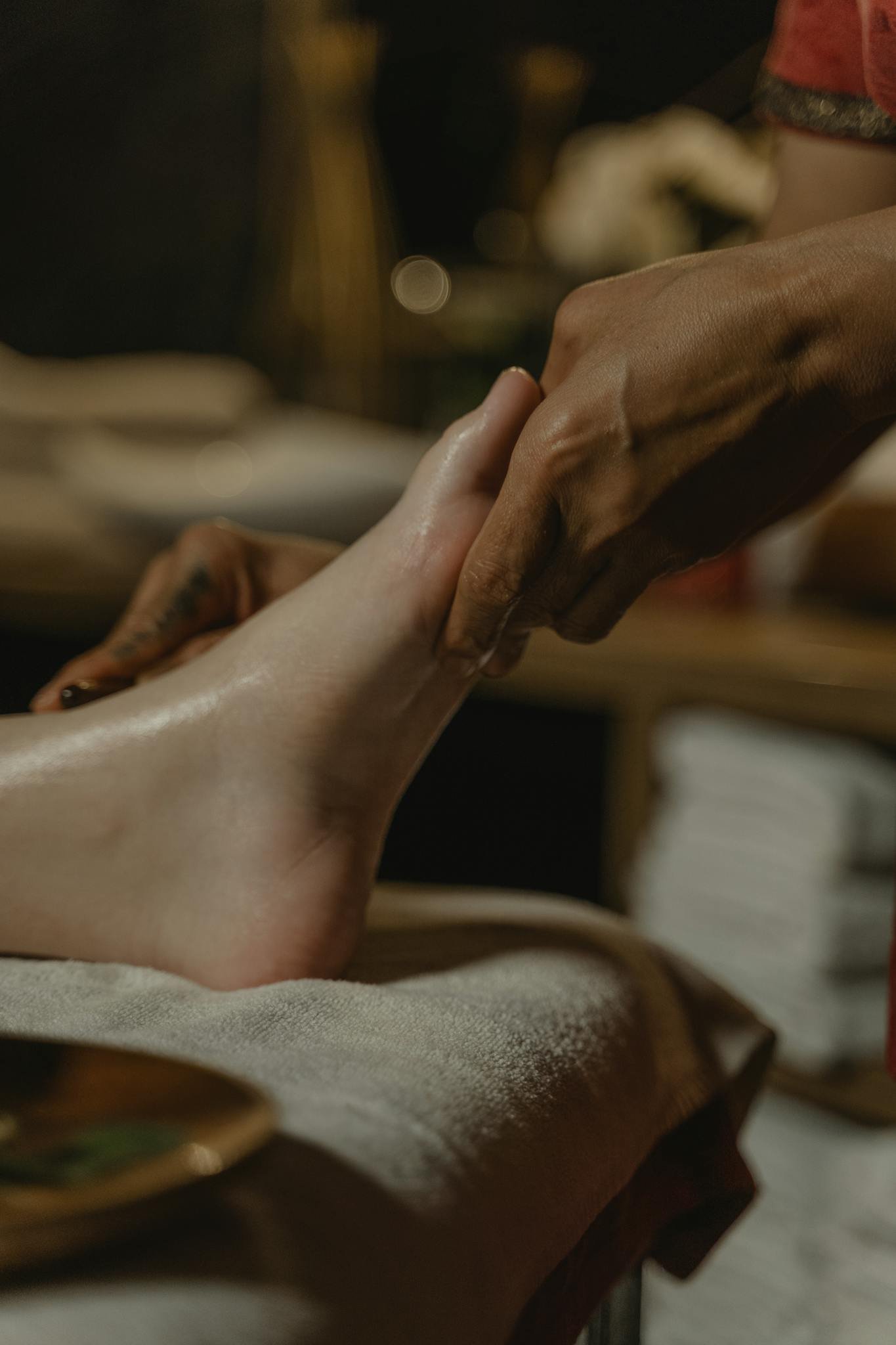 Close-up of a soothing foot massage in a tranquil spa environment, promoting relaxation and wellness.